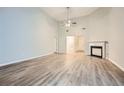 Spacious living room featuring wood-look floors and a cozy fireplace at 4394 Estate St, Atlanta, GA 30349