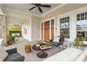 Inviting covered porch with stone pillars, comfortable seating, and views of the surrounding neighborhood at 205 Mead Rd, Decatur, GA 30030