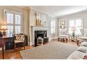 Elegant living room features a fireplace, hardwood floors, and bright natural light at 807 Longwood Dr, Atlanta, GA 30305
