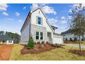 Beautiful exterior of a two-story home featuring a well-maintained lawn, stone accents and modern design at 4480 Beechnut Cir, Cumming, GA 30028
