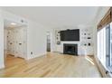 Bright living room with a fireplace, built-in shelving, and hardwood floors at 29 Ivy Ne Trl, Atlanta, GA 30342