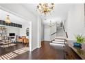 Inviting foyer with hardwood floors, elegant chandeliers, and staircase leading to the upper level at 508 Micayne Se Cir, Smyrna, GA 30082