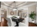 Elegant dining room boasting crown molding, modern lighting, and neutral paint, perfect for entertaining at 3510 Preserve Se Dr, Atlanta, GA 30339
