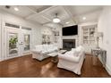 Cozy living room with a fireplace, built-in shelves, hardwood floors and neutral decor at 3510 Preserve Se Dr, Atlanta, GA 30339