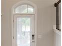Bright entryway featuring a door with transom window, digital lock, and wood-look flooring at 3533 Koyla Lndg # 5, Chamblee, GA 30341