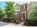 Beautiful townhome with manicured landscaping, stone facade, and a charming entryway at 3533 Koyla Lndg # 5, Chamblee, GA 30341