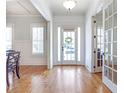 Bright foyer showcasing hardwood floors, white trim, and a glimpse of the living spaces at 4815 Westgate Dr, Cumming, GA 30040
