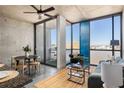 Open living area with modern furniture, large windows, and access to a balcony with seating at 480 John Wesley Dobbs Ne Ave # 810, Atlanta, GA 30312