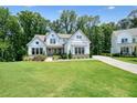 Charming two-story home with manicured lawn and beautiful landscaping in a tranquil neighborhood at 2861 Digna Ct, Acworth, GA 30101
