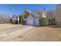 Traditional home with a two-car garage and ample driveway parking at 3624 Bancroft Main Nw, Kennesaw, GA 30144