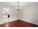 Bright dining room featuring hardwood floors and modern chandelier at 3284 Devaughn Ne Dr, Marietta, GA 30066