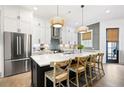 Spacious kitchen with a center island, stainless steel appliances, and pendant lighting at 2008 Cottonwood Ln, Woodstock, GA 30188