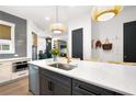 Modern kitchen with stainless steel appliances, quartz countertops, and a large island at 2008 Cottonwood Ln, Woodstock, GA 30188