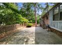Brick patio area with privacy wall, ideal for outdoor entertaining at 3319 Colony Dr, Conyers, GA 30013