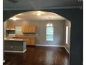 Open floor plan featuring hardwood floors, view of the kitchen, and natural light at 1466 Andrews Nw St, Atlanta, GA 30314