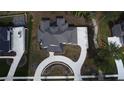 Aerial view of the house showing the roof line, driveway, and surrounding landscape at 583 Carl Sanders Dr, Acworth, GA 30101