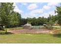 Community tennis and basketball courts surrounded by lush landscaping and greenery at 183 Brookwood Xing, Douglasville, GA 30134