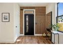 Stylish entryway with wooden accent wall, hardwood floors and sleek decor at 593 Formwalt Sw St, Atlanta, GA 30312