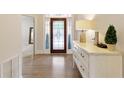 Elegant entryway featuring a decorative glass door, light-toned walls, and hardwood flooring at 1950 Buford Dam Rd # 105, Cumming, GA 30041