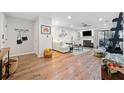 Bright, open living room featuring hardwood floors, fireplace, ceiling fan, and ample space for entertaining at 14 Hampshire Ct, Avondale Estates, GA 30002