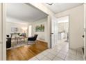 Bright living room featuring hardwood floors, elegant furnishings and seamless flow into the adjacent kitchen at 1105 Orchard Way, Roswell, GA 30075
