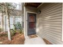 Front entrance with a door, side window, and a 'oh hello' welcome mat at 2706 Country Park Se Dr, Smyrna, GA 30080