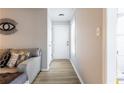 Bright hallway features hardwood floors, modern decor, and a fresh coat of paint at 2706 Country Park Se Dr, Smyrna, GA 30080