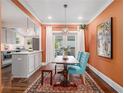 Stylish dining area with colorful walls, modern light fixture, and an ornate rug at 427 S Columbia Dr, Decatur, GA 30030