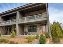 Multi-story home featuring private covered balconies, brick facade and manicured landscaping at 6460 Cortland Walk, Alpharetta, GA 30005