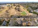 Aerial view of a golf course neighborhood, complete with a lake, course and club house at 310 Allendale Se Dr, Atlanta, GA 30317