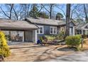 Side view showcasing a beautiful bungalow with a connected carport at 310 Allendale Se Dr, Atlanta, GA 30317