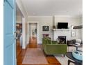 Living room with hardwood floors, fireplace, and inviting light-filled space at 310 Allendale Se Dr, Atlanta, GA 30317