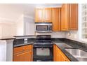 Well-equipped kitchen offers modern appliances, granite countertops, and convenient breakfast bar at 10 Perimeter Summit Ne Blvd # 3204, Atlanta, GA 30319