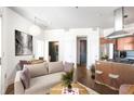 Cozy living room and kitchen with stainless appliances, granite counters, and a dining area at 2626 Peachtree Nw Rd # 1102, Atlanta, GA 30305
