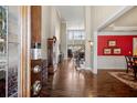 Grand foyer with soaring ceilings, hardwood floors, and elegant decor leading to the living spaces at 955 Golf View Ct, Dacula, GA 30019