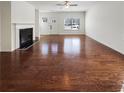 Spacious living room boasts gleaming hardwood floors and a cozy fireplace at 807 Ambient Sw Way, Atlanta, GA 30331