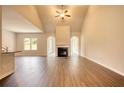 Bright and airy living room featuring a fireplace and vaulted ceiling at 700 Park Place Way, Social Circle, GA 30025