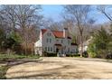 Beautiful home with a red tile roof, well-maintained landscaping, and ample curb appeal at 1122 Springdale Ne Rd, Atlanta, GA 30306