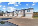 Row of new townhomes features convenient parking and contemporary designs at 308 Shine Dr, Stockbridge, GA 30281