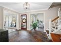 Open foyer with slate flooring, views to the living spaces, and natural light from large windows at 501 Brook Hollow Se Cir, Marietta, GA 30067