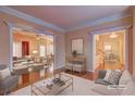 Bright and airy living room with hardwood floors and elegant furnishings at 1225 Sand Knoll Sw Run, Lilburn, GA 30047