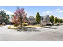 A neighborhood street view showcasing well-maintained homes with manicured lawns and trees at 1350 Bluestone Dr, Cumming, GA 30041