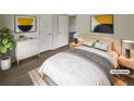 Bright staged bedroom with modern décor, natural light, and new flooring at 207 Autumn Lake Way, Mcdonough, GA 30253