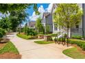 Charming neighborhood view with sidewalks, landscaping, and bike rack for outdoor enjoyment at 720 Tannery Cmn, Alpharetta, GA 30009