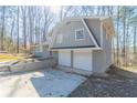Charming split-level home featuring a two-car garage and a distinctive red front door at 3585 Ale Cir, Atlanta, GA 30344