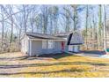 Charming split-level home featuring a two-car garage and a distinctive red front door at 3585 Ale Cir, Atlanta, GA 30344