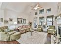 Inviting living room with high ceilings, fireplace, and an array of natural light at 2817 Middlecreek Way # 1703, Cumming, GA 30041