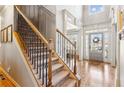 Elegant foyer with hardwood floors, staircase, and large windows providing ample natural light at 2952 Perimeter Cir, Buford, GA 30519
