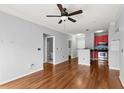 A spacious living room area featuring hardwood floors and an open floor plan to kitchen at 10 Perimeter Summit Ne Blvd # 4312, Atlanta, GA 30319