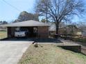 A carport with a cement foundation and a truck parked inside at 2870 Whiteview Nw Dr, Acworth, GA 30101
